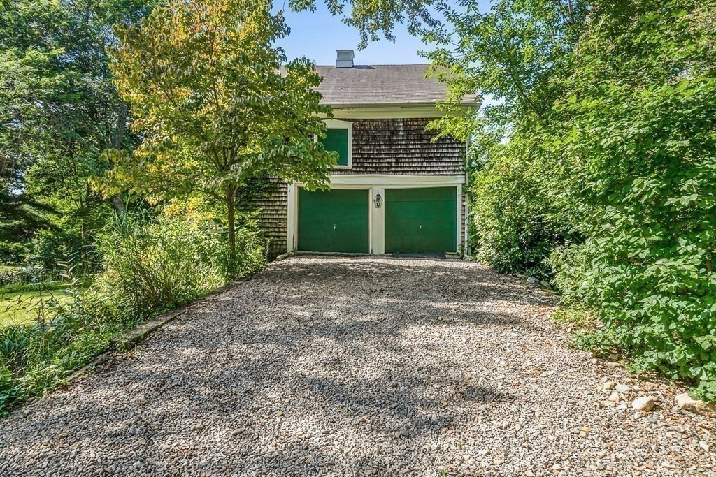 216 Spring Street Marshfield, MA 02050 - Photo 6 of 36 a front view of a house with yard and trees