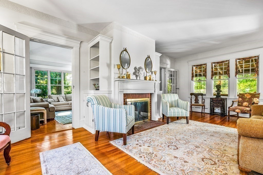 216 Spring Street Marshfield, MA 02050 - Photo 7 of 36 a living room with furniture and a fireplace