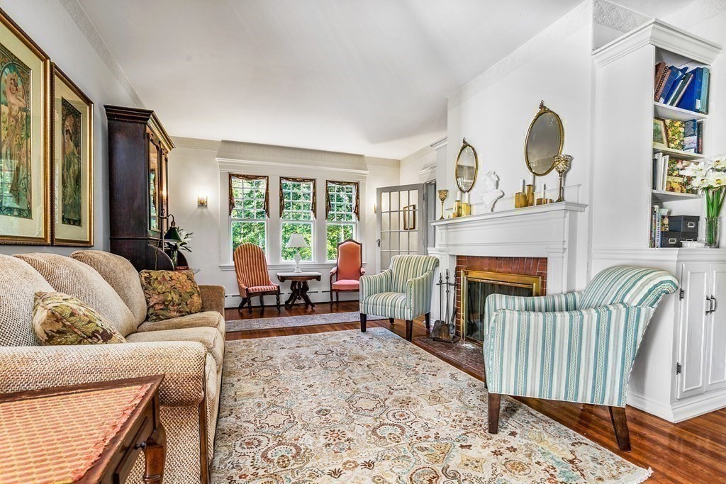 216 Spring Street Marshfield, MA 02050 - Photo 8 of 36 a living room with furniture and a fireplace
