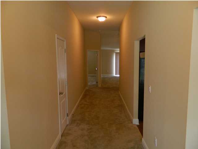 4611 Hermosa Road Crestview, FL 32539 - Photo 2 of 19 a view of a hallway with a glass door