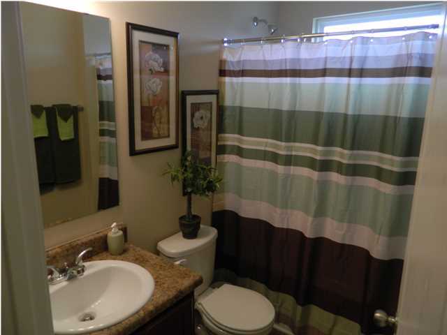 4611 Hermosa Road Crestview, FL 32539 - Photo 11 of 19 a bathroom with a sink toilet and shower