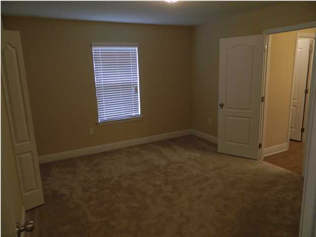 4611 Hermosa Road Crestview, FL 32539 - Photo 13 of 19 a view of an empty room with a window