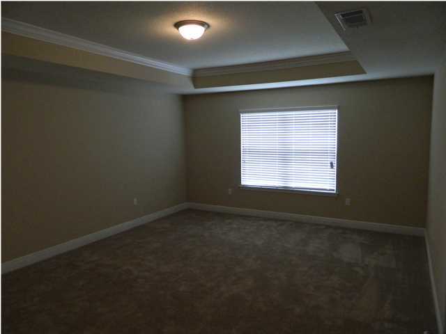 4611 Hermosa Road Crestview, FL 32539 - Photo 4 of 19 a view of an empty room with a window