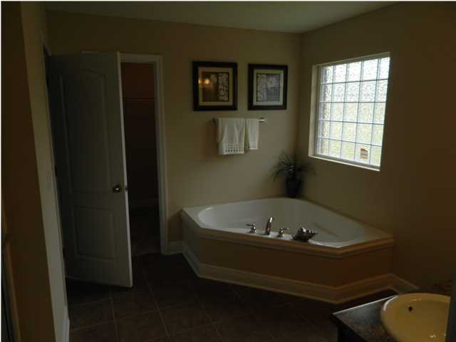 4611 Hermosa Road Crestview, FL 32539 - Photo 5 of 19 a bathroom with a tub and a window