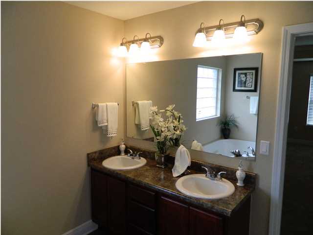 4611 Hermosa Road Crestview, FL 32539 - Photo 6 of 19 a bathroom with a sink and a mirror