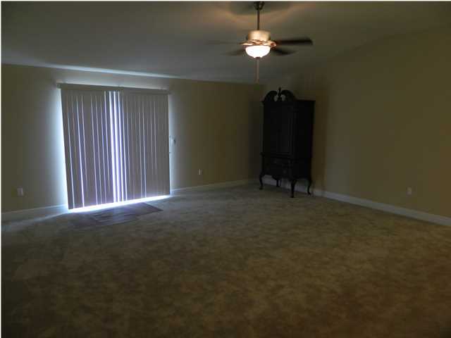 4611 Hermosa Road Crestview, FL 32539 - Photo 9 of 19 an empty room with windows and closet