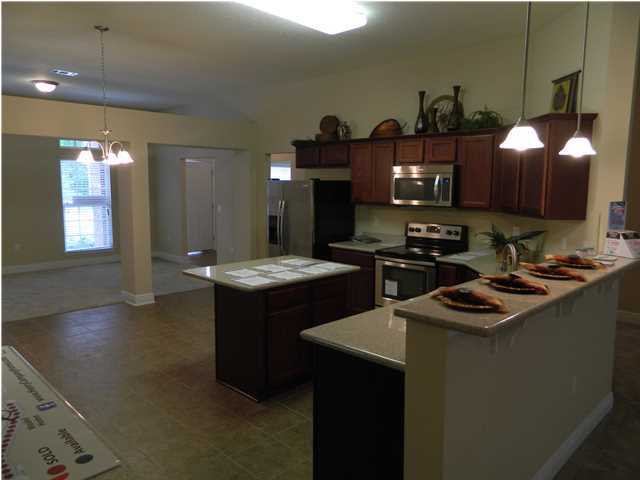 4611 Hermosa Road Crestview, FL 32539 - Photo 10 of 19 a kitchen that has a sink and a stove