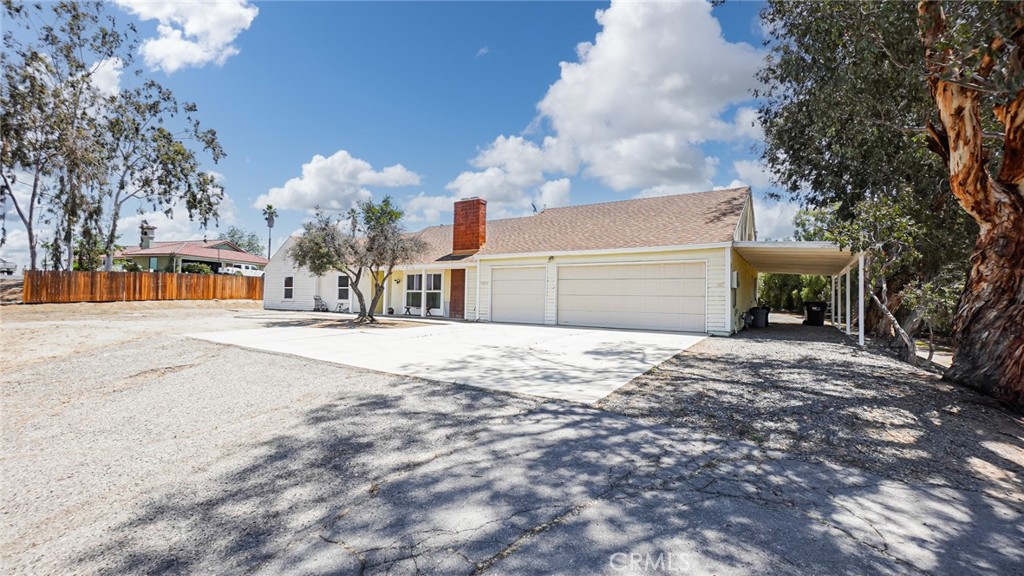 18570 Halter Lane Riverside, CA 92504 - Photo 2 of 63 A spacious 3-CAR GARAGE with ample parking. potential for ADU/JADU use, workshop space, storage, or hobby needs