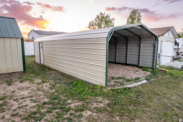 634 South 2100th Street West Vernal, UT 84078 - Photo 60 of 71 Open-sided metal carport with gravel flooring
