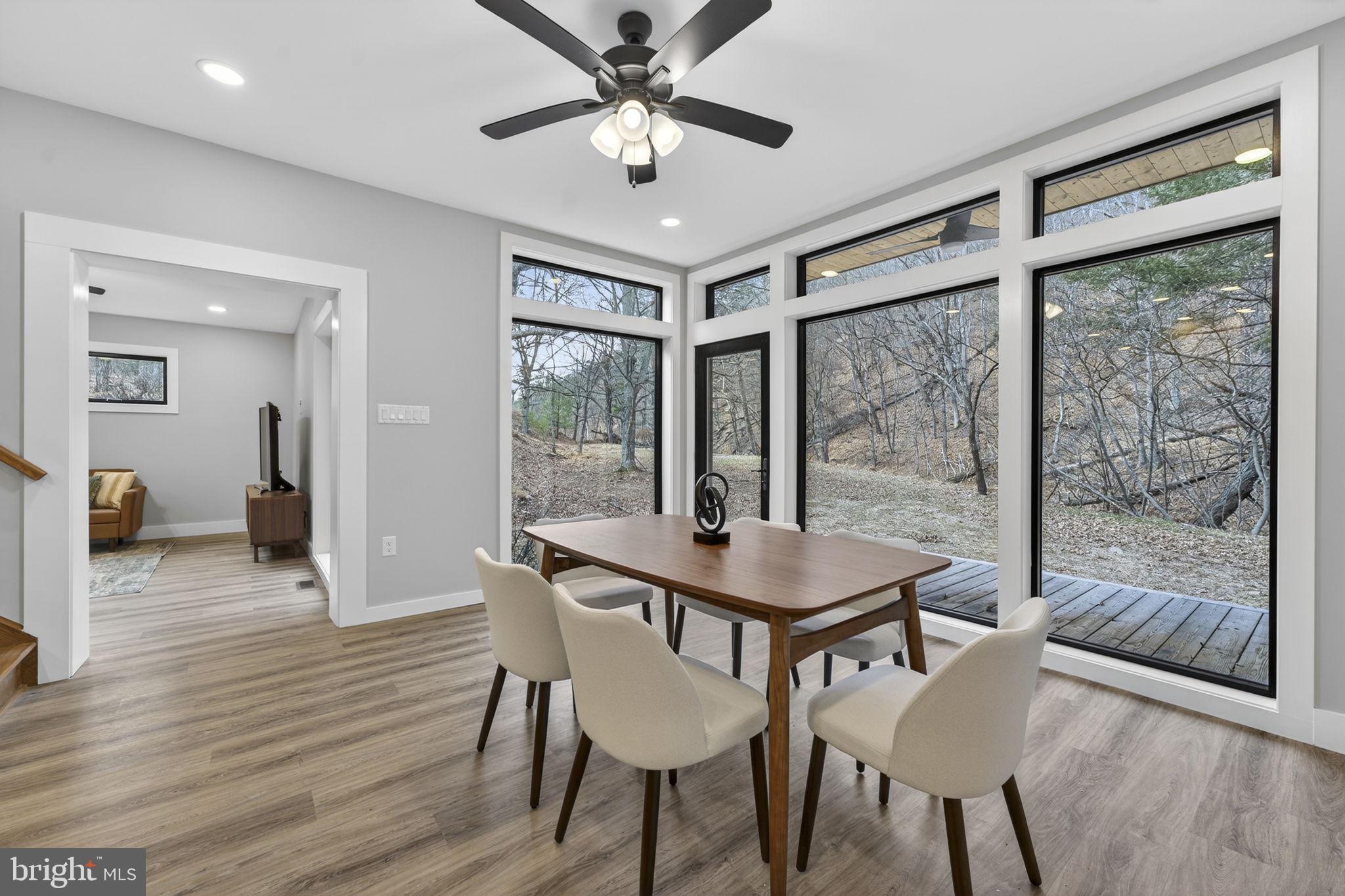 1956 Dove Hollow Road Mathias, WV 26812 - Photo 21 of 113 a view of a dining room with furniture window and wooden floor