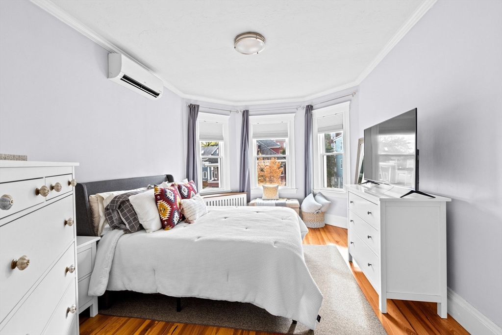 108 King Street, Unit THREE Boston, MA 02122 - Photo 11 of 18 a bedroom with bed and window