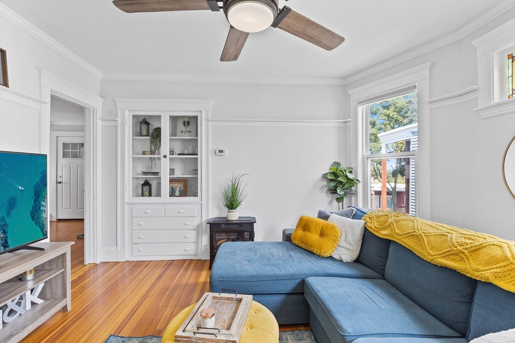 108 King Street, Unit THREE Boston, MA 02122 - Photo 5 of 18 a living room with furniture and a flat screen tv