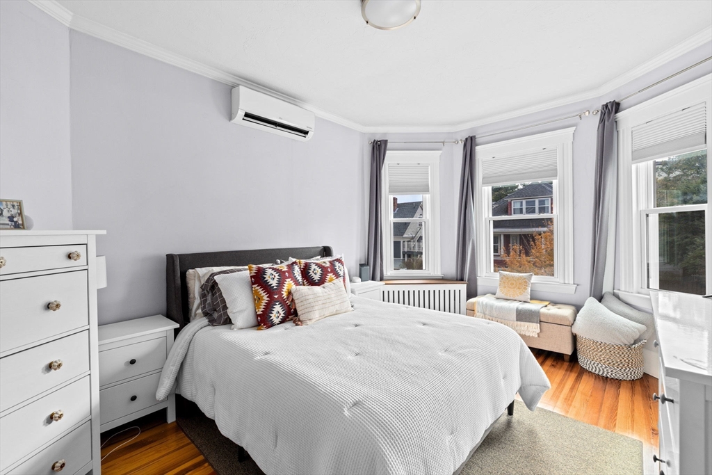 108 King Street, Unit THREE Boston, MA 02122 - Photo 10 of 18 a bedroom with a bed and a window