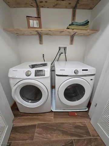 a utility room with dryer and washer