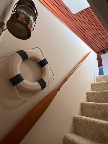 a large bedroom with a large bed and a large window