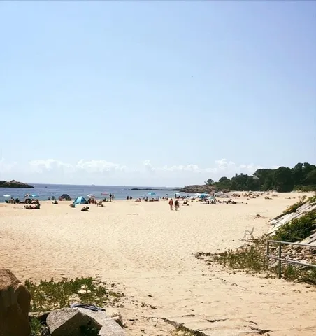 a view of a swimming pool with a table and chairs