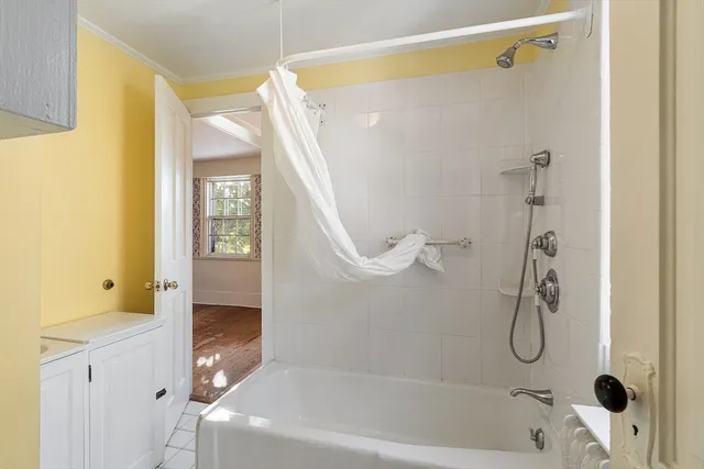 a bathroom with a granite countertop shower a mirror and a sink