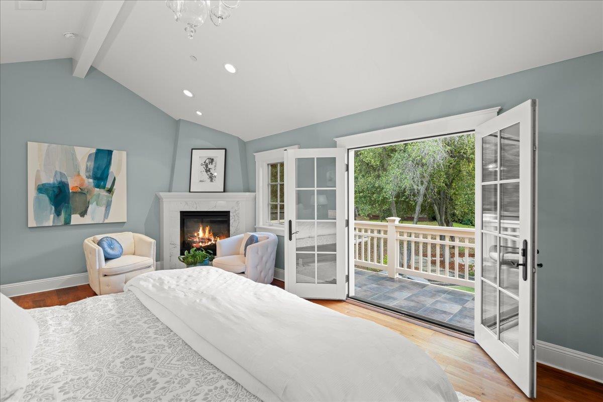 3510 Alpine Road Portola Valley, CA 94028 - Photo 26 of 77 a bedroom with furniture and a fireplace