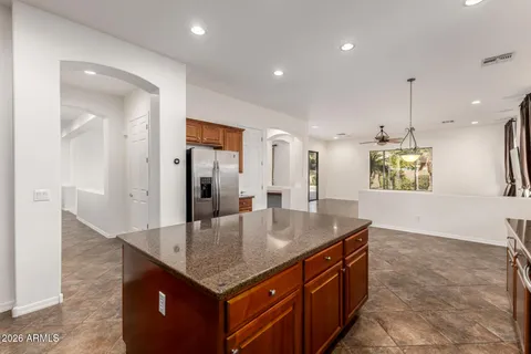 a kitchen with cabinets and stainless steel appliances