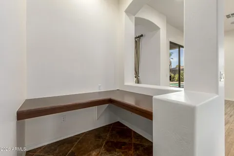 a view of a living room a flat screen tv and a kitchen