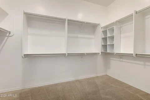 an empty room with closet area