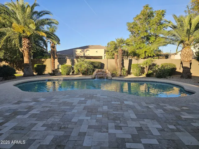 a view of swimming pool with a yard