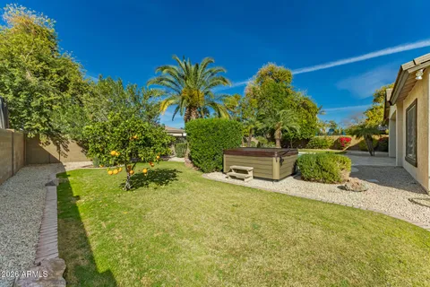 a view of a garden with an outdoor seating