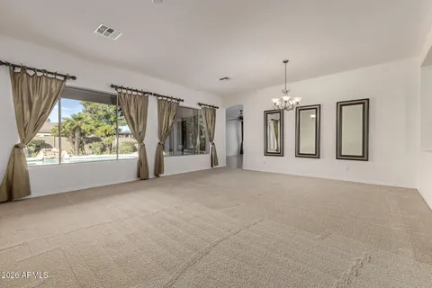 a kitchen with stainless steel appliances granite countertop a sink and a refrigerator