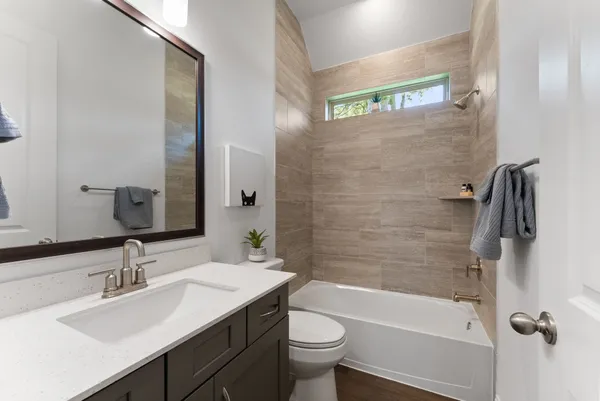 a bathroom with a sink a toilet and a bathtub