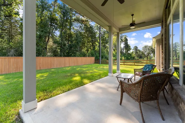 a view of swimming pool with a bench and a yard