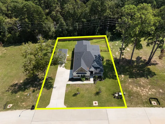a view of outdoor space with playground and green space