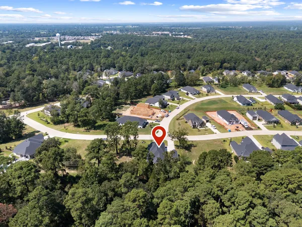 a view of swimming pool with outdoor seating and plants