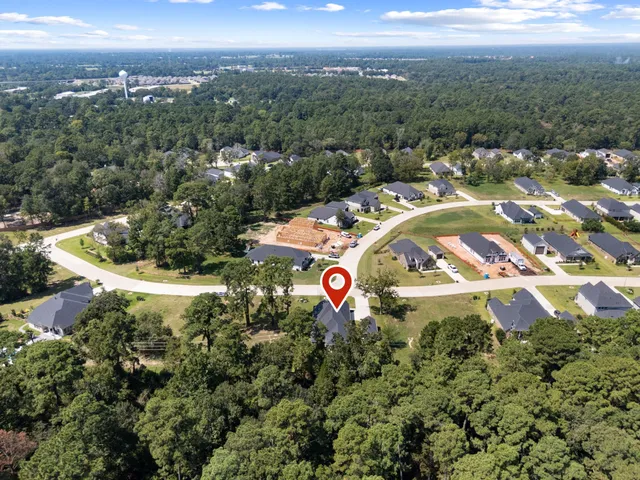 a view of swimming pool with outdoor seating and plants