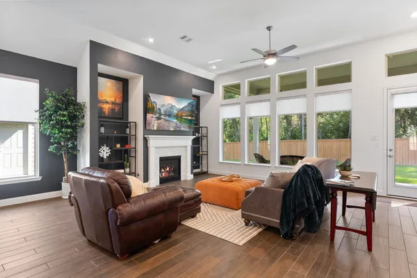 a spacious bedroom with a large bed and a large window