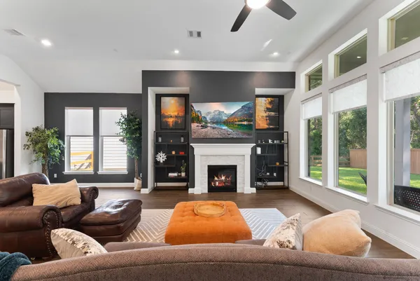 a living room with furniture and a fireplace