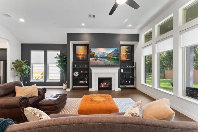 a living room with furniture and a fireplace
