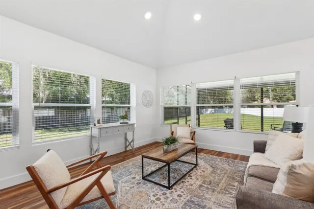 a kitchen with stainless steel appliances a stove a refrigerator a sink and cabinets