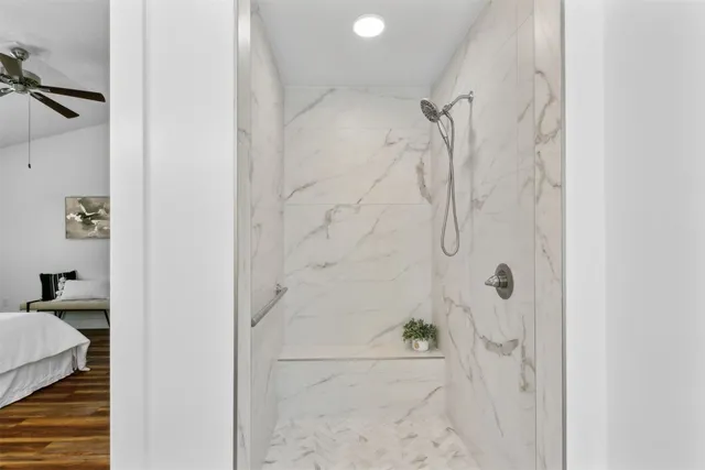 a view of an empty room and wooden floor