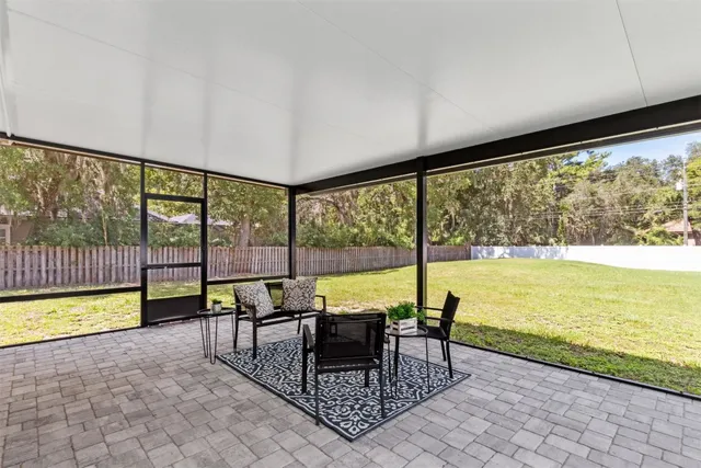 an aerial view of residential house with outdoor space and lake view