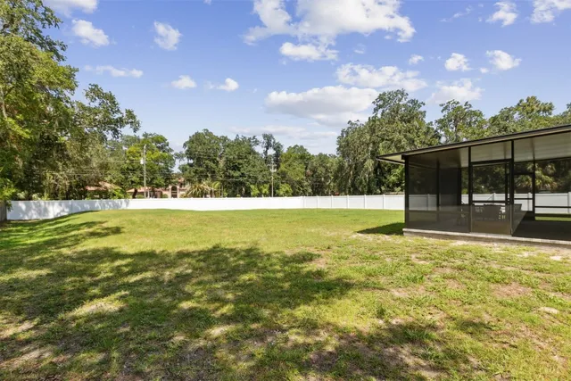 an aerial view of a houses with outdoor space and lake view