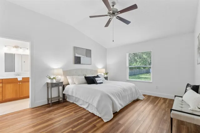 a view of a house with a yard and pathway