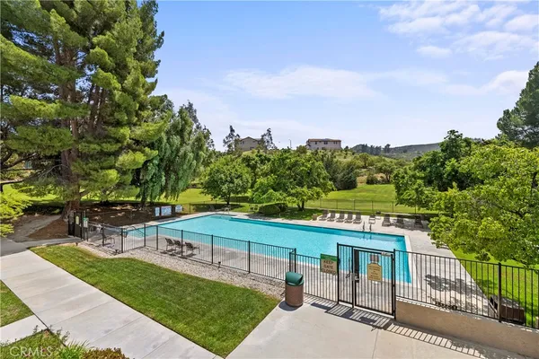 a view of a swimming pool with a patio