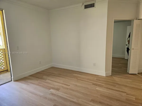a kitchen with granite countertop a sink stove and cabinets