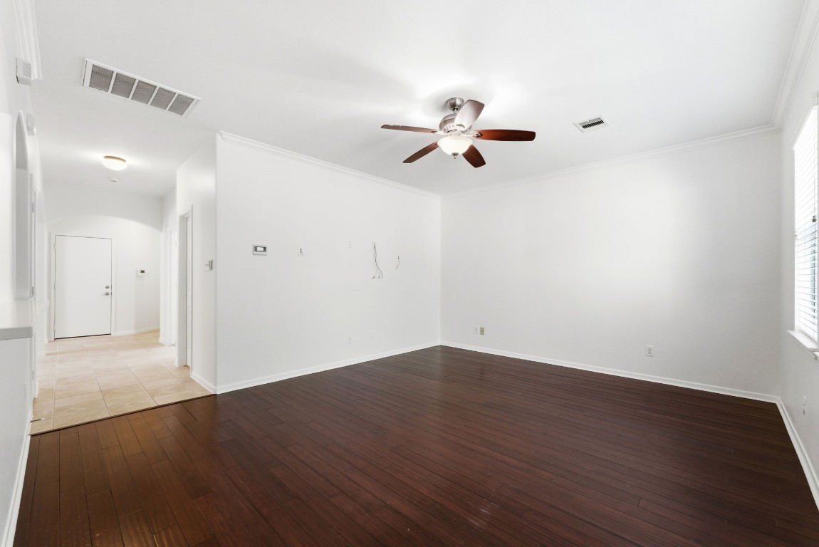 6407 Wilshire Ridge Houston, TX 77040 - Photo 13 of 37 a view of a room with wooden floor and a ceiling fan