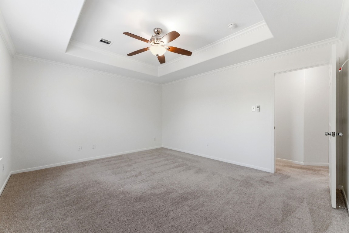 6407 Wilshire Ridge Houston, TX 77040 - Photo 21 of 37 an empty room with windows and fan