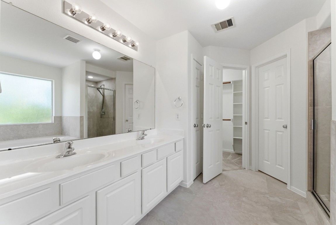 6407 Wilshire Ridge Houston, TX 77040 - Photo 23 of 37 a spacious bathroom with a double vanity sink mirror and double