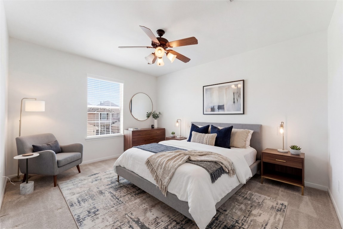 6407 Wilshire Ridge Houston, TX 77040 - Photo 29 of 37 a bedroom with a bed and a chandelier