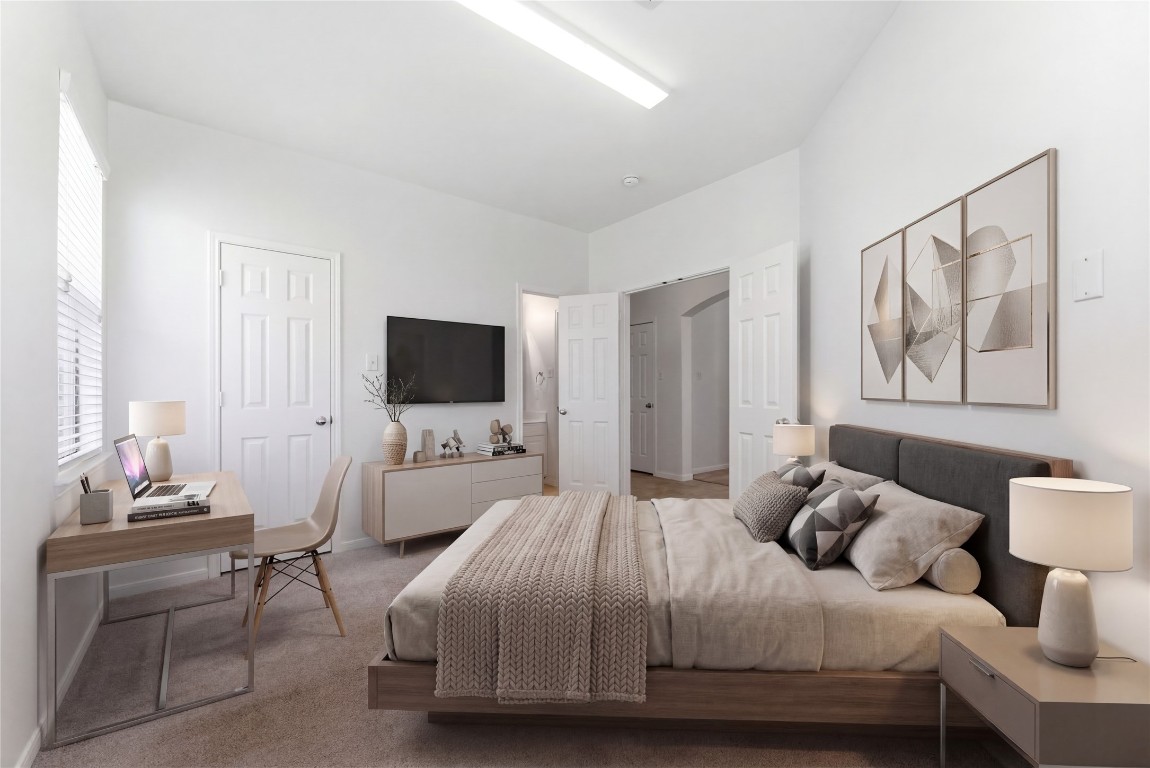 6407 Wilshire Ridge Houston, TX 77040 - Photo 10 of 37 a bedroom with a bed and a flat screen tv