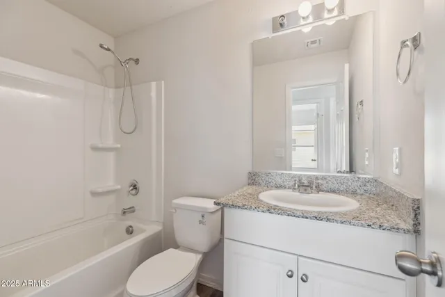 a bathroom with a sink toilet tub and shower