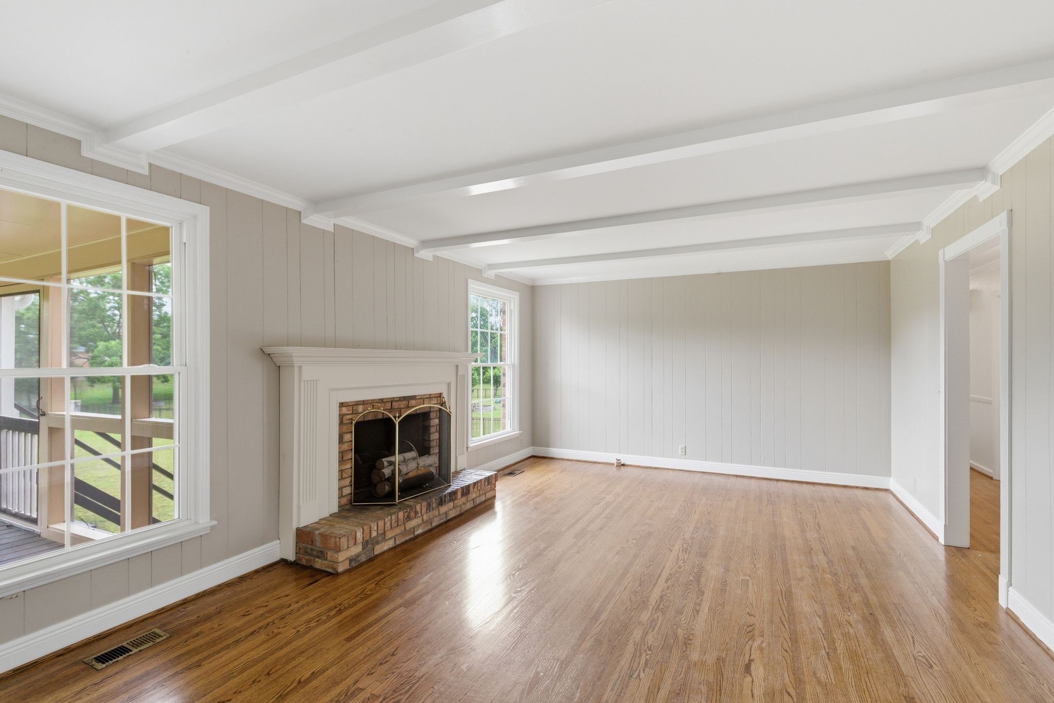 213 Rising Sun Lane Old Hickory, TN 37138 - Photo 37 of 37 a view of an empty room with wooden floor fireplace and a window
